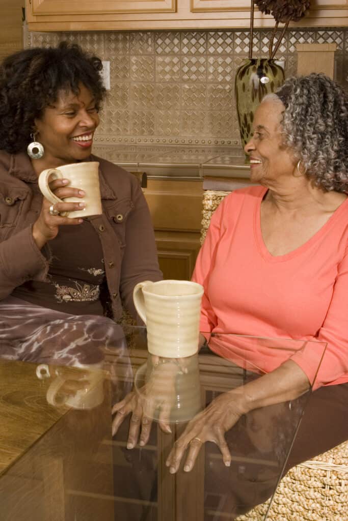 Mother and daughter laughing together as caregiving changes relationships